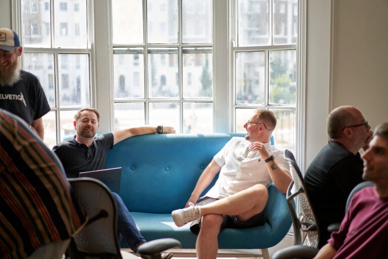 Photo of the bozboz team discussing the voices of business survey in our office