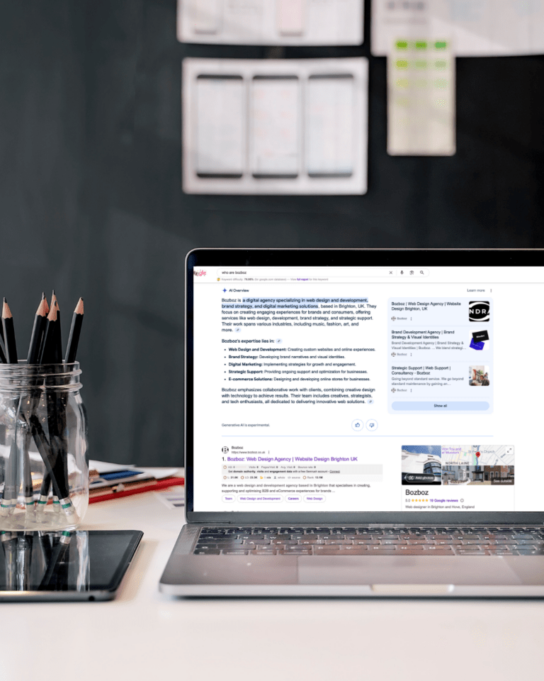 Image of Bozboz AI overview result added to a macbook screen for how to stand a better chance of being seen in ai overviews blog.